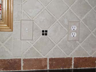 Installed ceramic tile switch plate covers