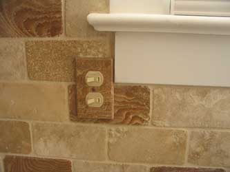 Installed travertine marble switch plate cover